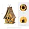 Glitzhome® 9.5" Yellow Distressed Wood Birdhouse with Leaves